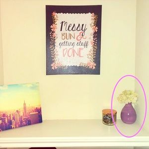 Glass purple vase with white fake flowers